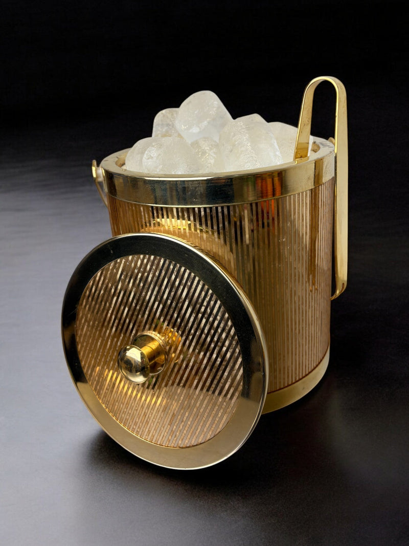 Gilded brass ice bucket with ribbed texture and crystal chunks detail