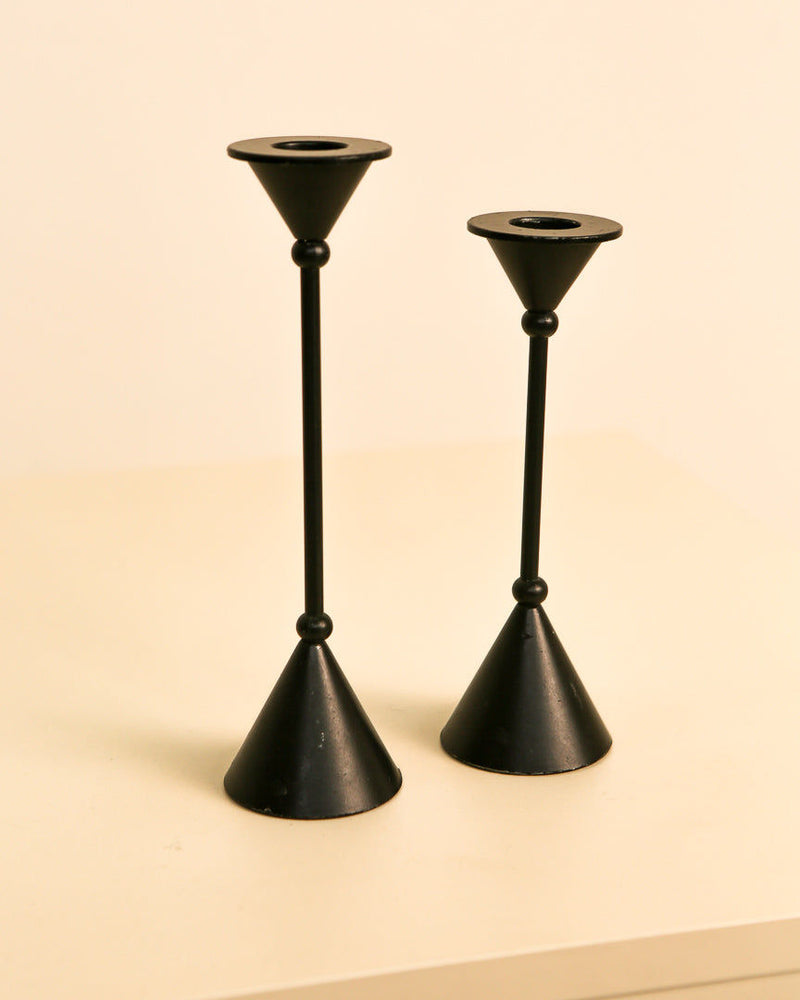 Black metal Memphis candleholders pair showing conical bases detail