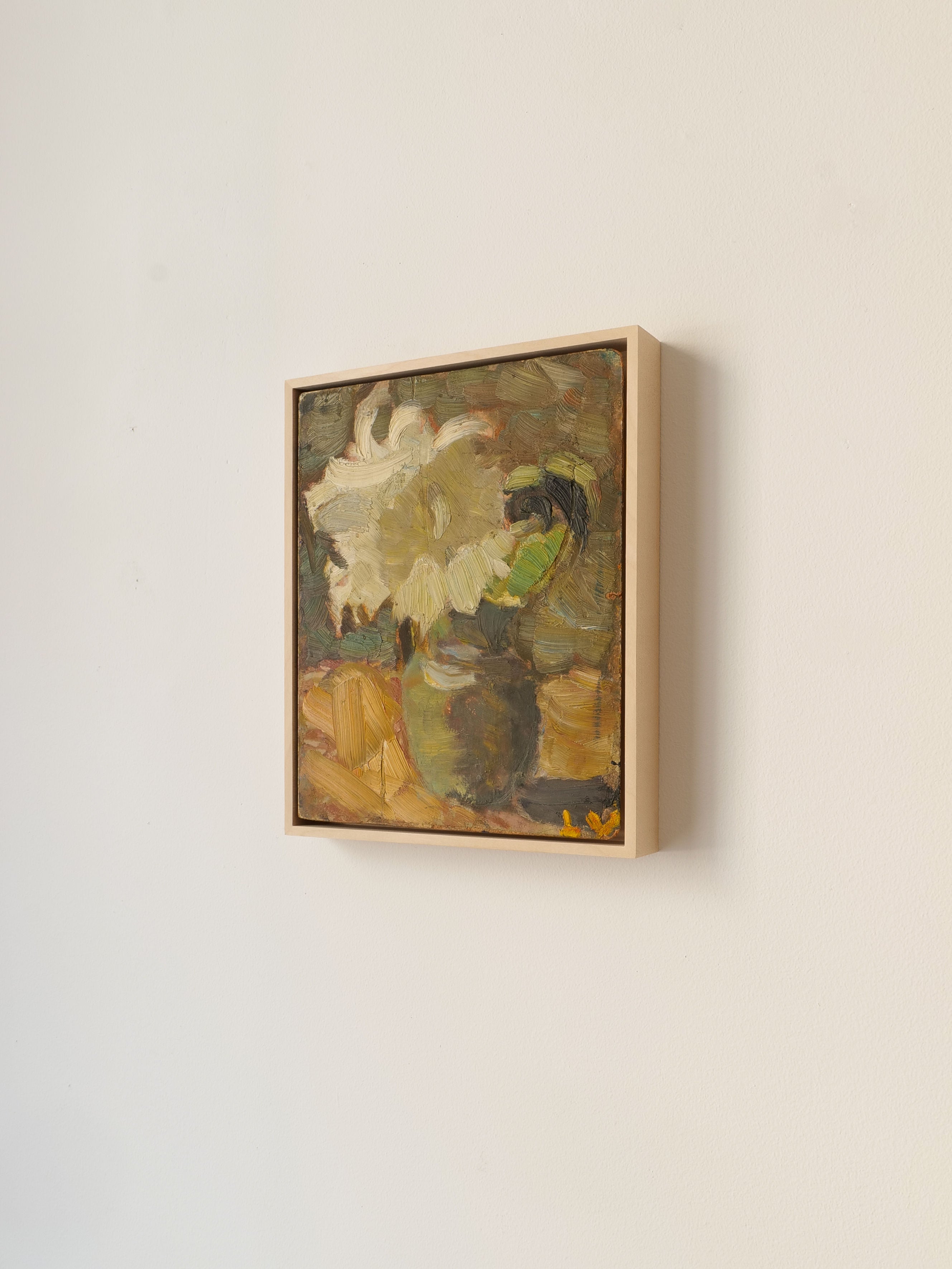 The "Still Life Lars Vidlund Flower" by Collection apart is a framed painting of a flower in a vase, mounted on a plain white wall. Rendered in loose, impressionistic strokes, the artwork primarily features earthy tones of green, beige, and yellow within an autumn color palette. The white flower adds contrast to the muted background.