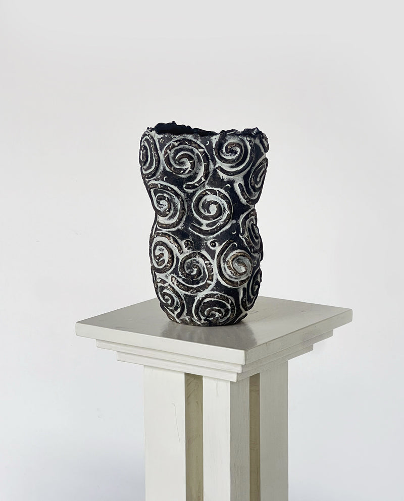 Black ceramic vase with raised spiral pattern by Porter Studio