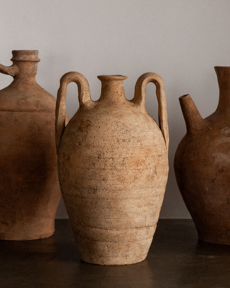 Group of ceramic amphoras with speckled terra cotta finish
