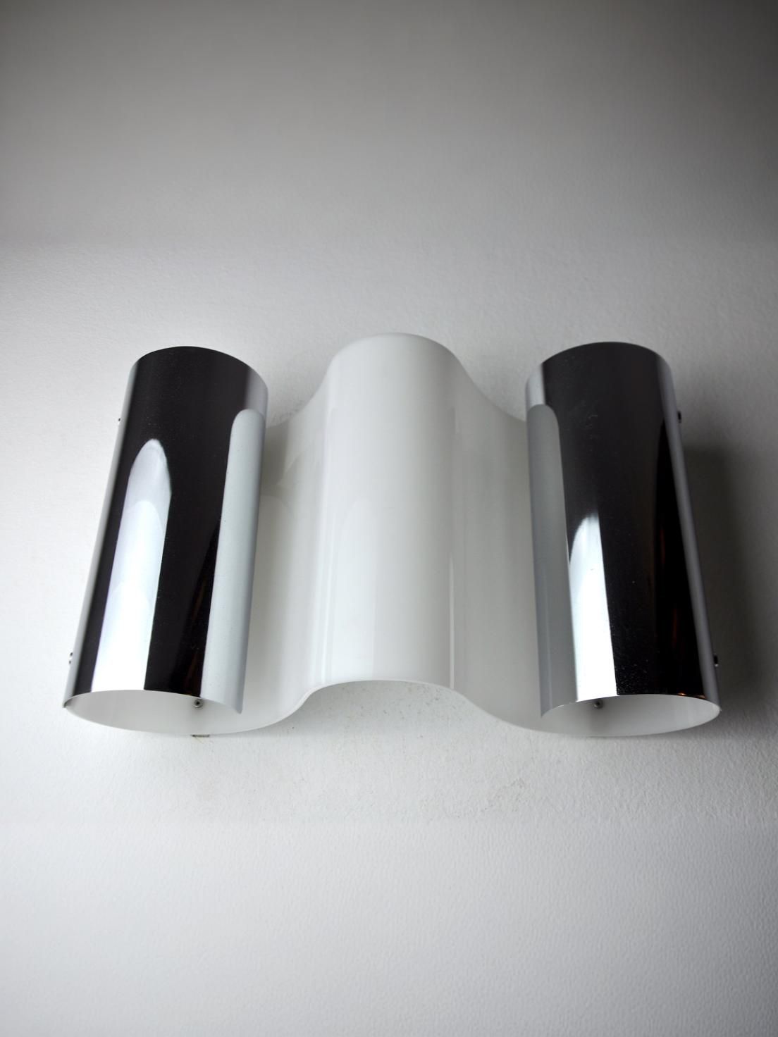 Three Metalarte Wave wall sconces showing black and white finishes