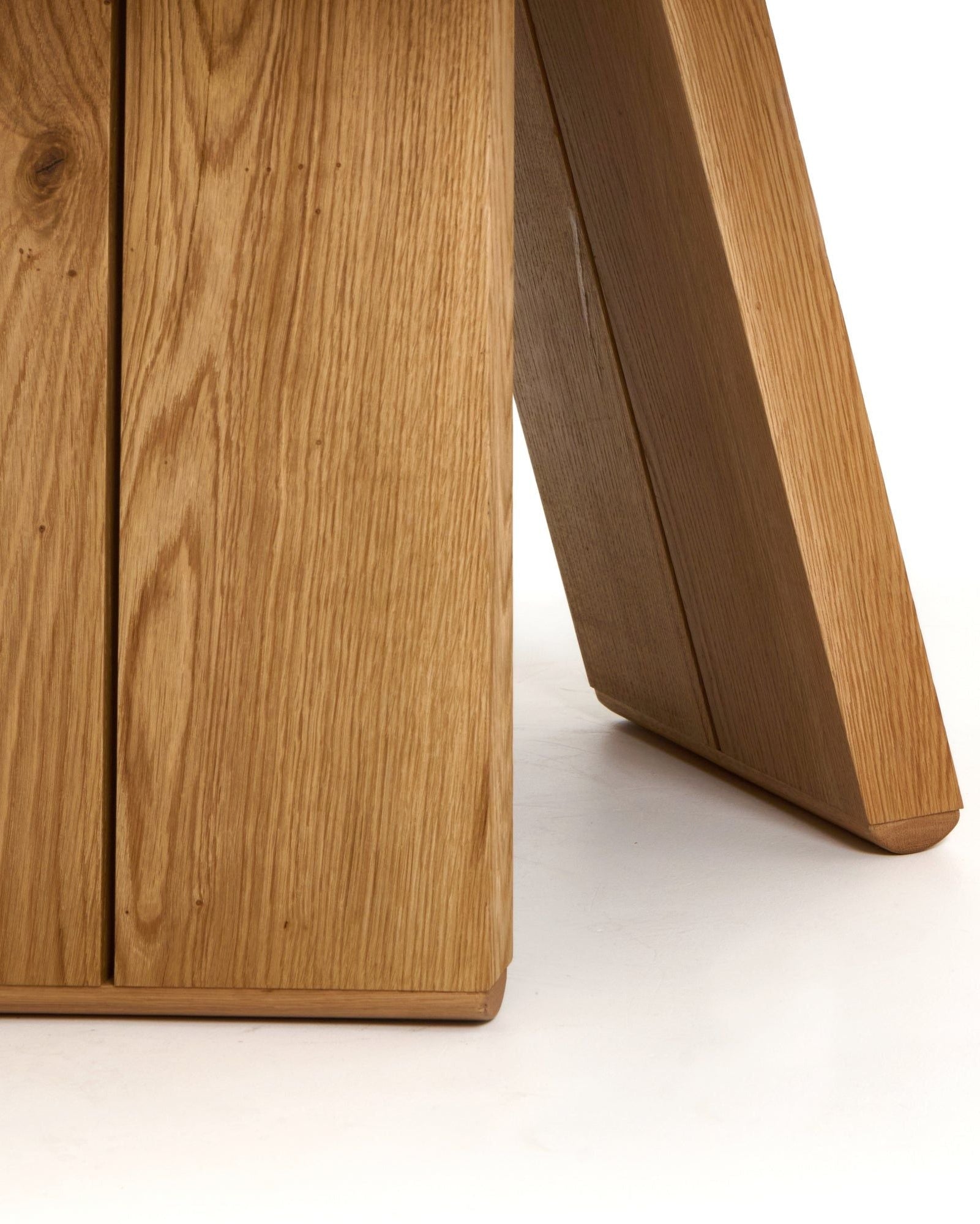 Oak dining table leg detail showing curved bentwood construction