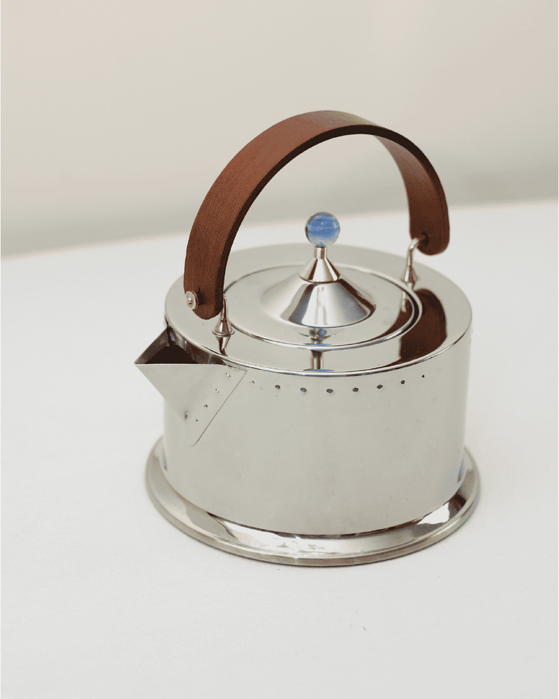Polished steel teapot with leather handle by Carsten Jorgensen
