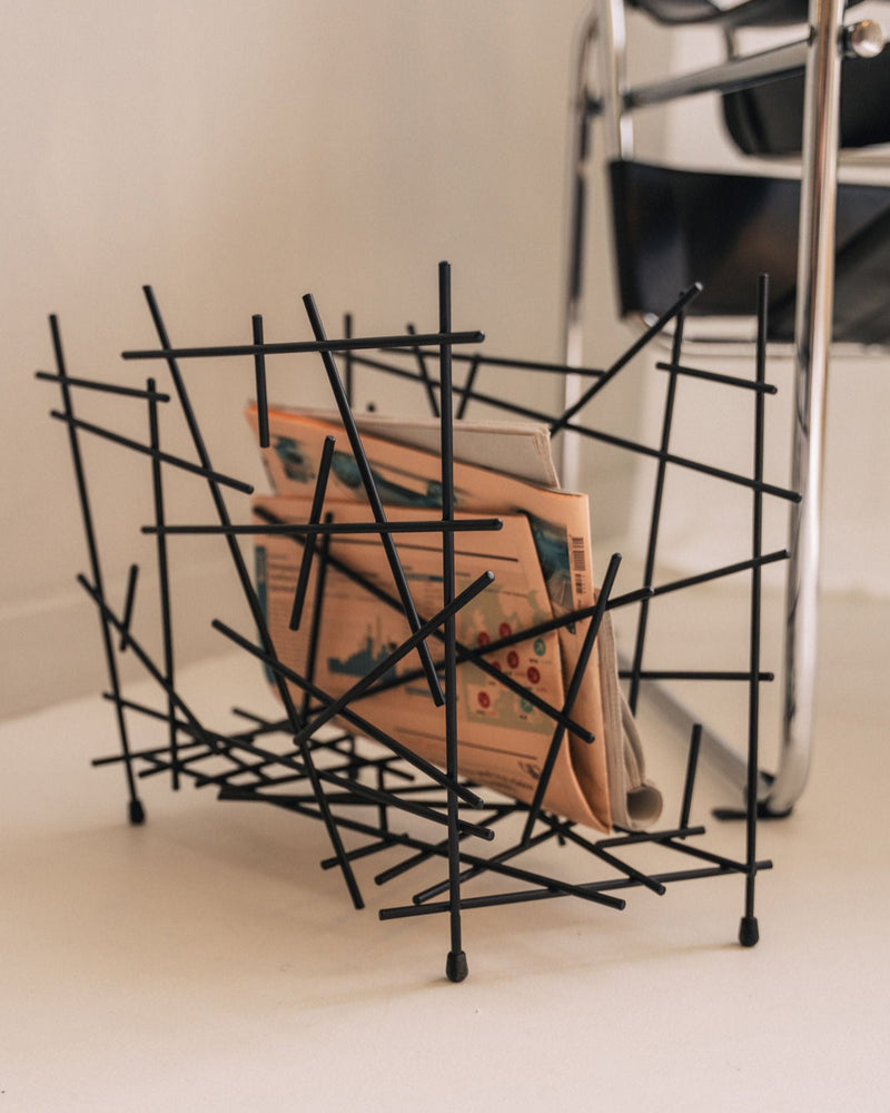 Alessi Fratelli Campana black wire magazine rack with books