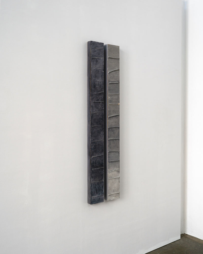 Two-panel abstract composition showing textured vertical strips in charcoal and grey tones