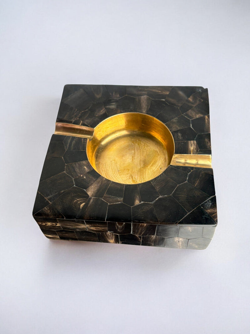 Faux tortoiseshell ashtray with brass bowl detail view