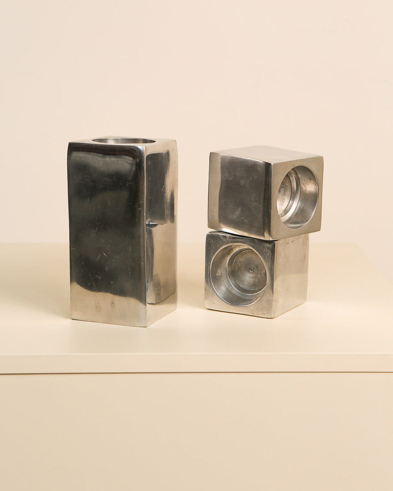 Modern aluminum candleholders showing geometric cube design and sleek finish