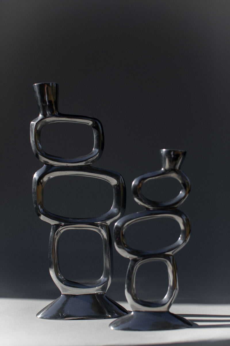 Pair of brutalist glass candleholders with geometric forms by Matthew Hilton