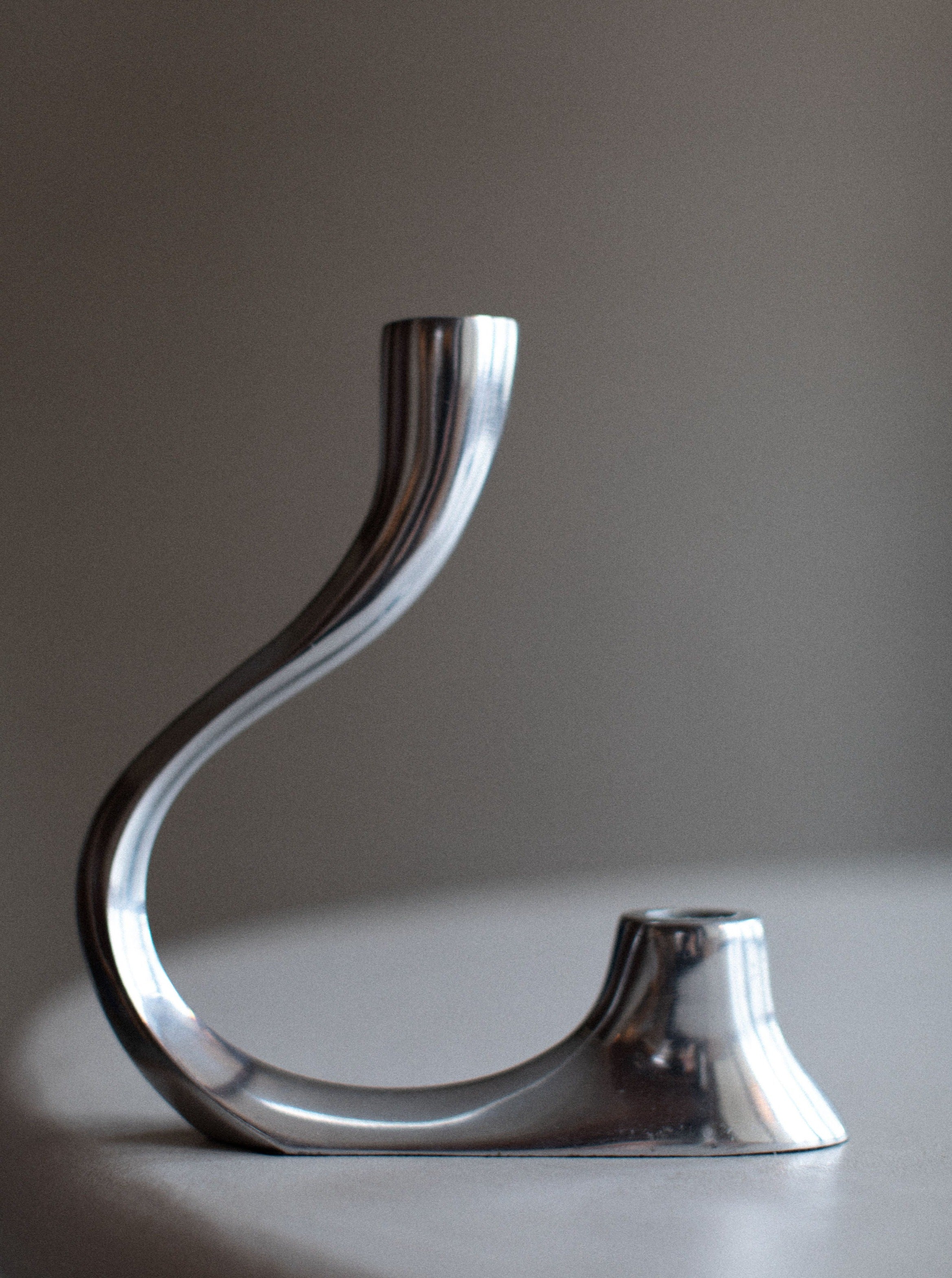 Vintage chrome candleholder with intricate design and elegant finish