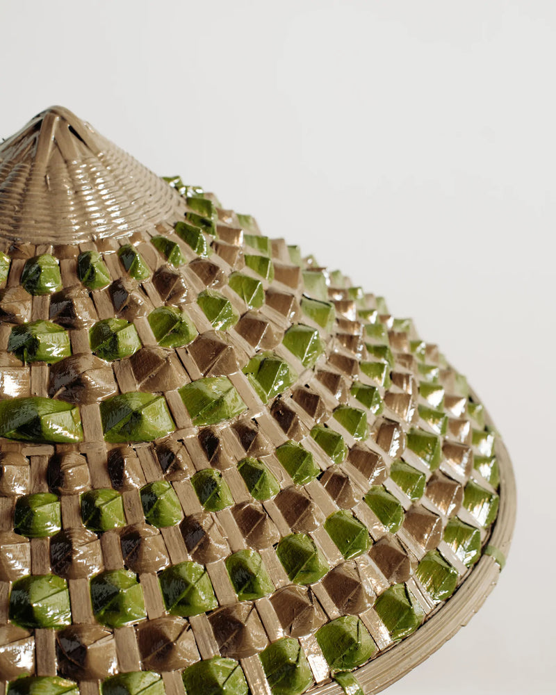 Woven basket detail of Horst tripod floor lamp with natural fibers