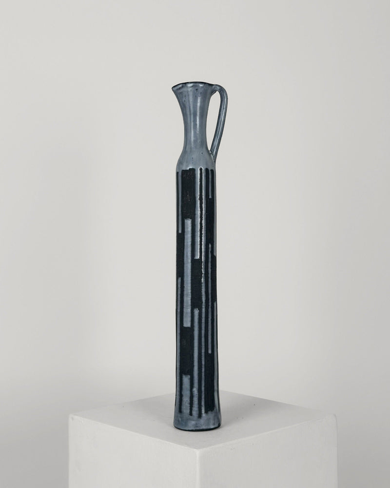 Large blue ceramic bottle vase with geometric cutouts by Pouchain
