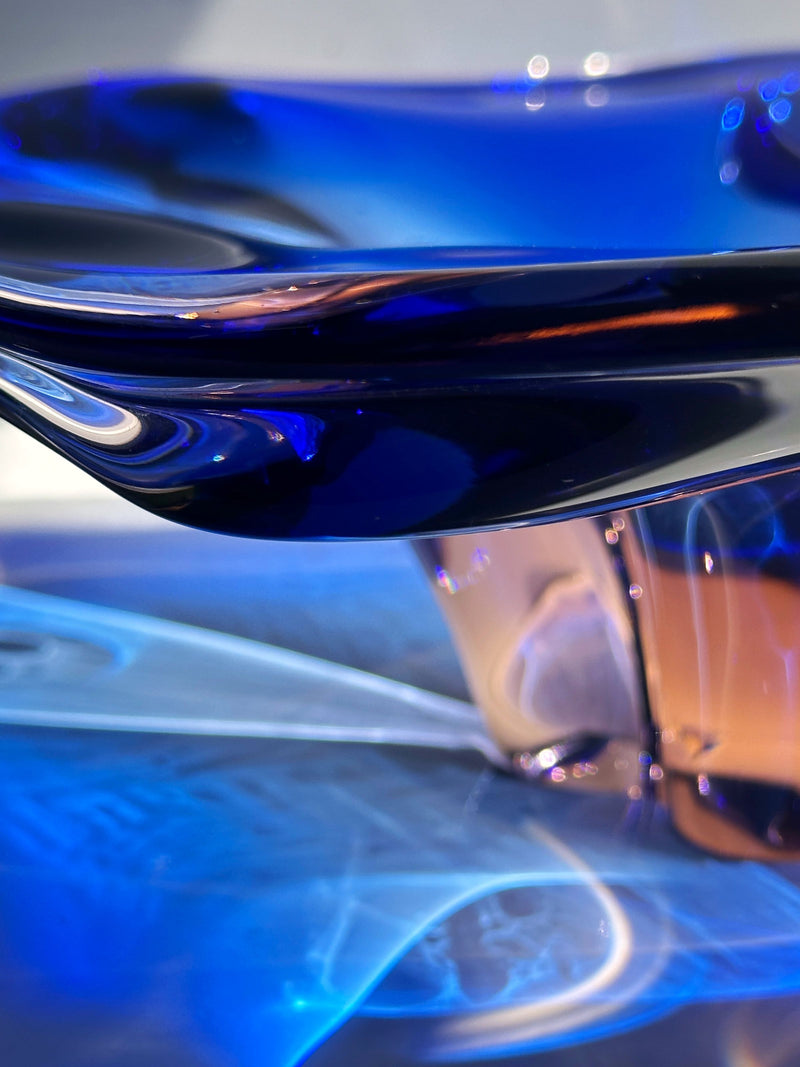 Close-up detail of cobalt blue Bohemian glass bowl showing curved rim
