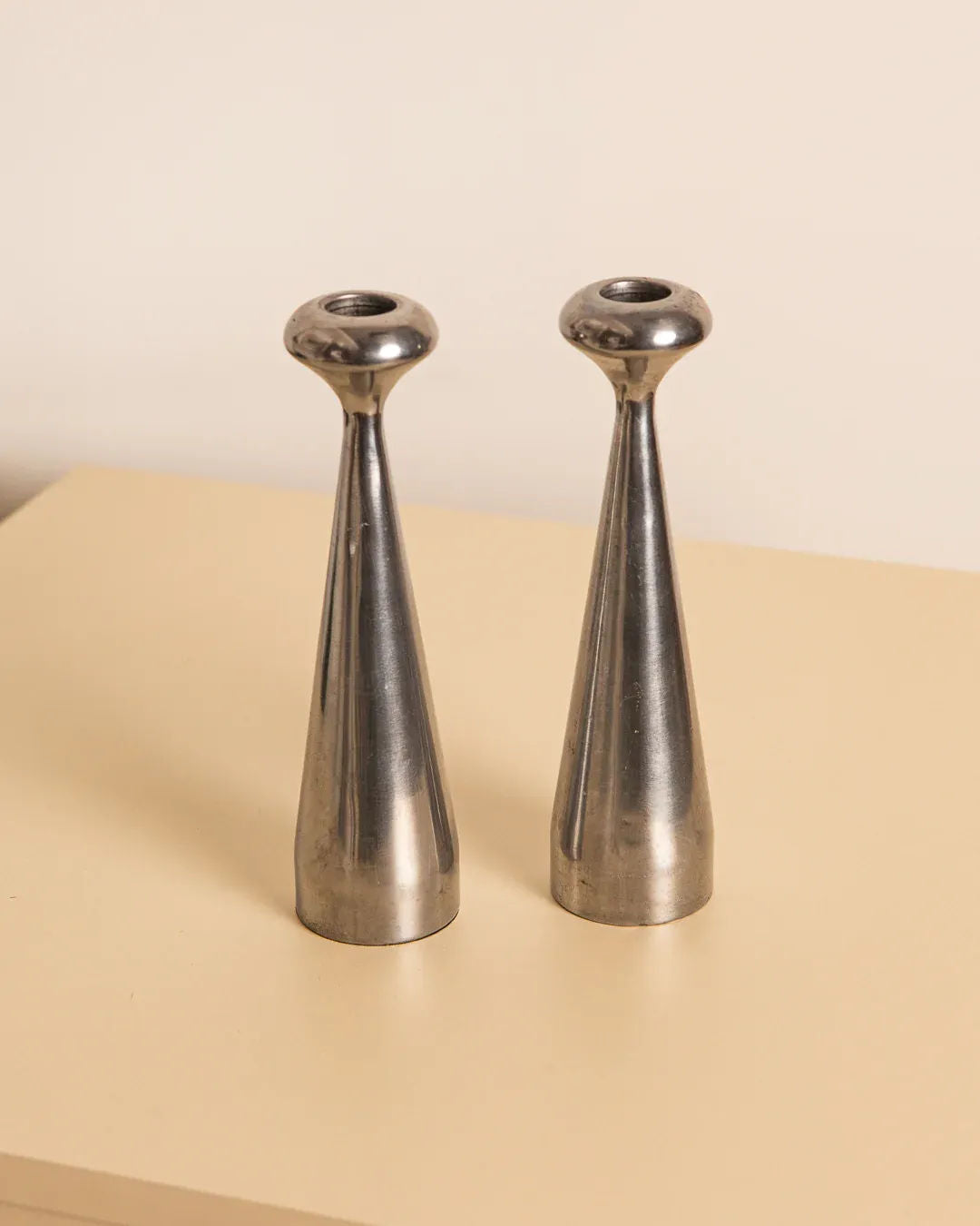 Pair of 80's aluminum “Quille” Candleholders