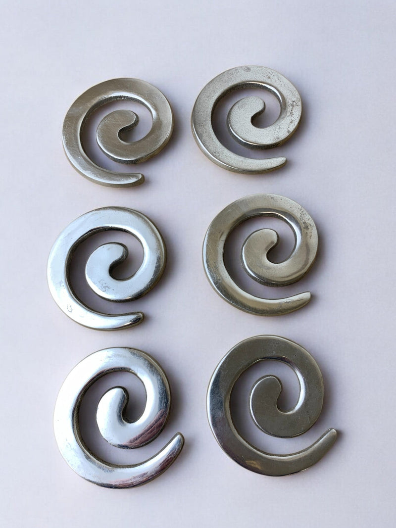 Set of six spiral aluminum coasters in biomorphic design, Spain 1980s