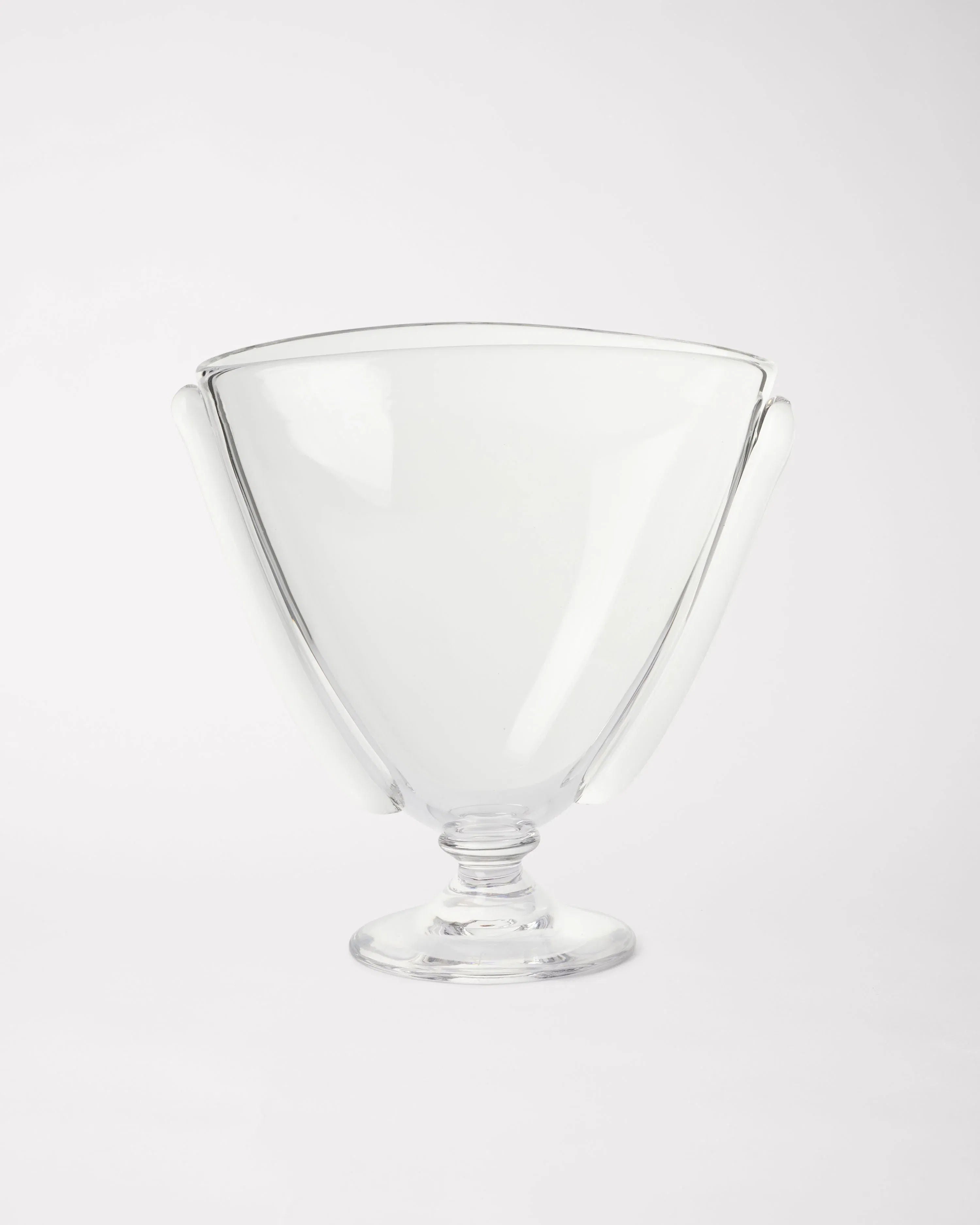 The Akua Objects Karl Vase is a stunning Bohemian glass piece with a wide rim, tapered sides, and sturdy rounded base. Elegantly designed as a centerpiece bowl, its artisanal charm is highlighted against a plain white background.