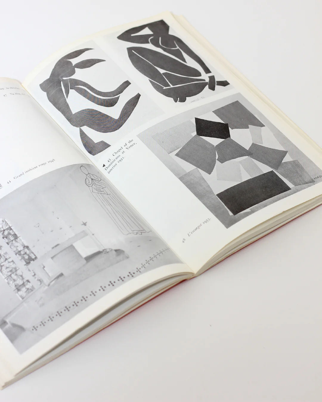 The "Matisse on Art Book" from Boga Avante Shop invites you into a realm of artistic thought with its open pages displaying modern abstract art and a room photograph, elegantly resting on a white surface.