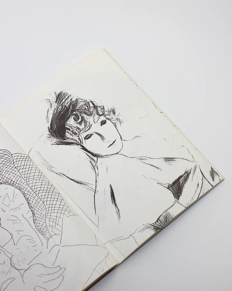 The product "Faces by David Hockney" from Boga Avante Shop features a black ink sketch on an open page, illustrating a reclining figure with short, curly hair and closed eyes. The minimal lines and shading evoke calm simplicity, enhancing the art book's serene vibe.