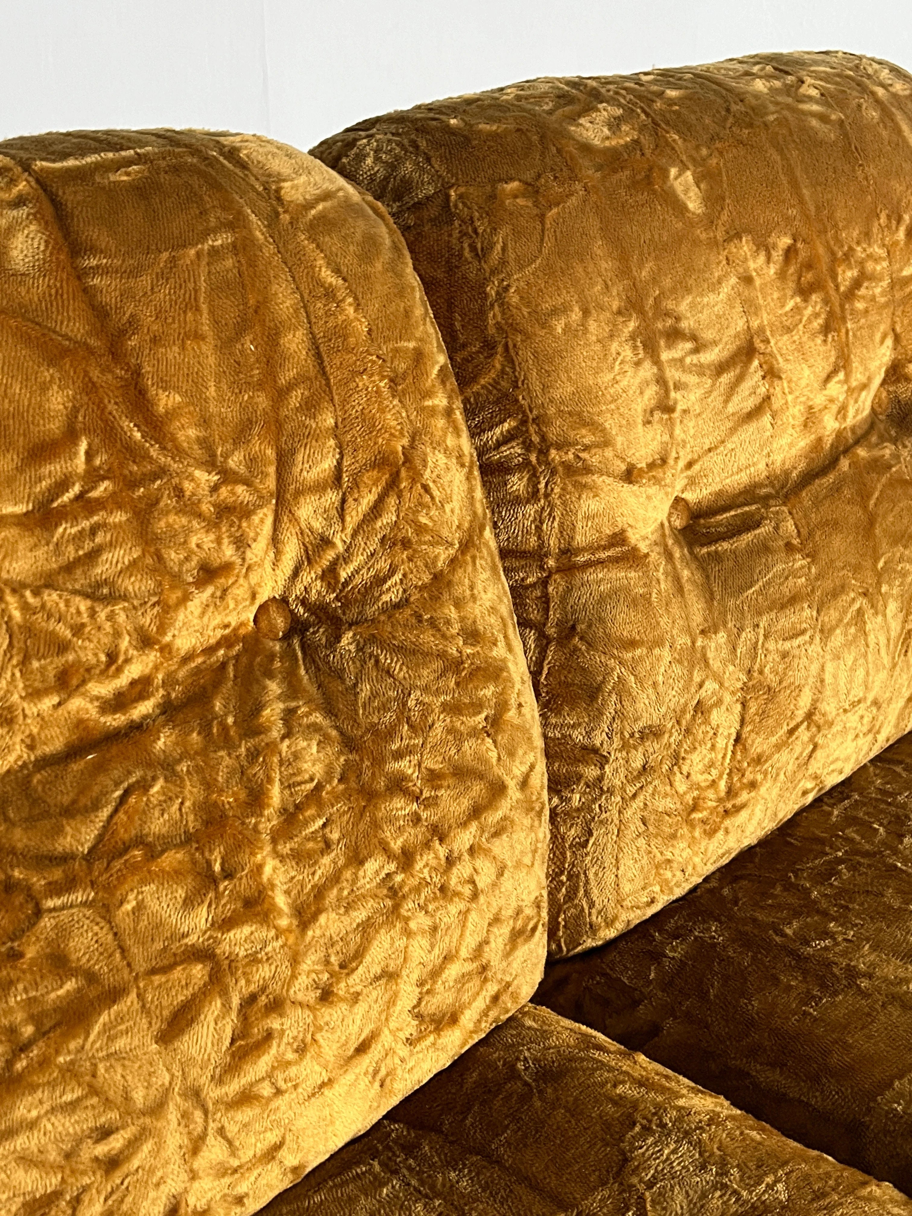 Close-up of a vintage-style Cherry Cargo Adriano Piazzesi 'Okay' Sofa Seating Set, 1970s, with tufted back cushions. The plush ochre velvet fabric has a textured, wrinkled look that exudes soft luxury reminiscent of a Mid-Century icon.