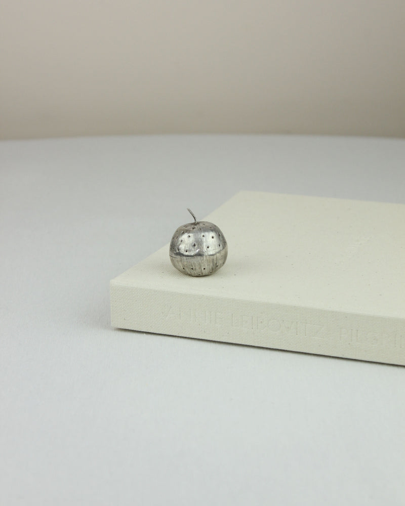 Sterling silver apple-shaped pillbox with engraved details