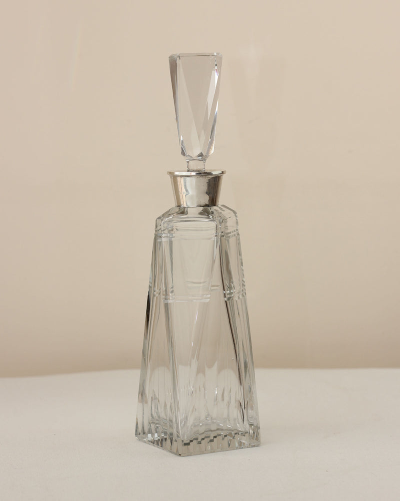 Art Deco crystal decanter with geometric faceted design and stopper