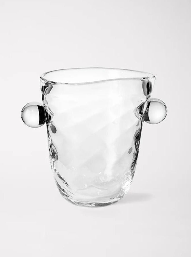 A clear, textured glass Oliver Vase with two spherical handles on each side, showcasing Akua Objects' dedicated craftsmanship. The slightly irregular, handcrafted appearance adds character, set against a plain white background.