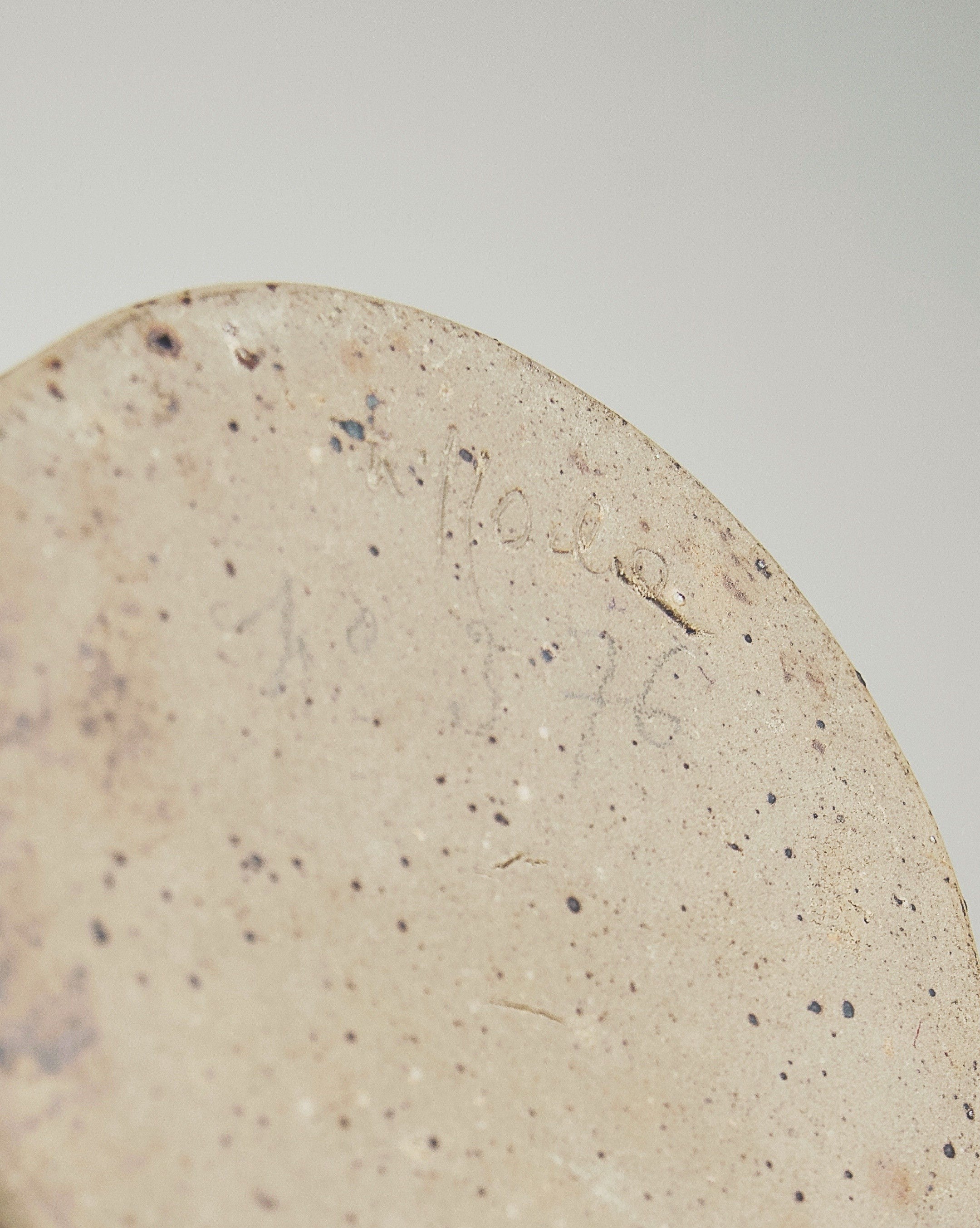 Close-up detail of speckled ceramic texture on Soliflore vase