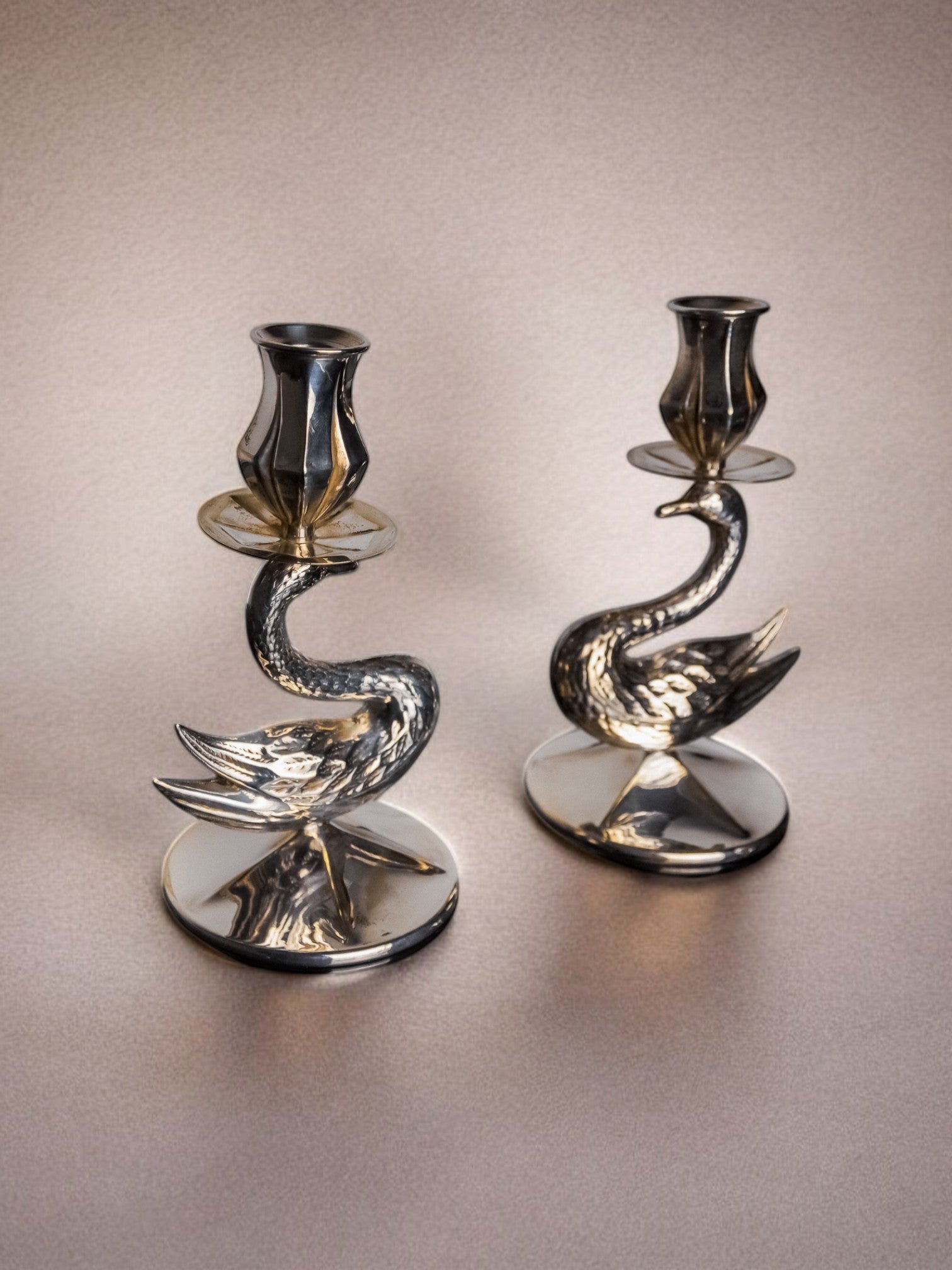 Pair of Art Deco swan candleholders in polished alpaca metal