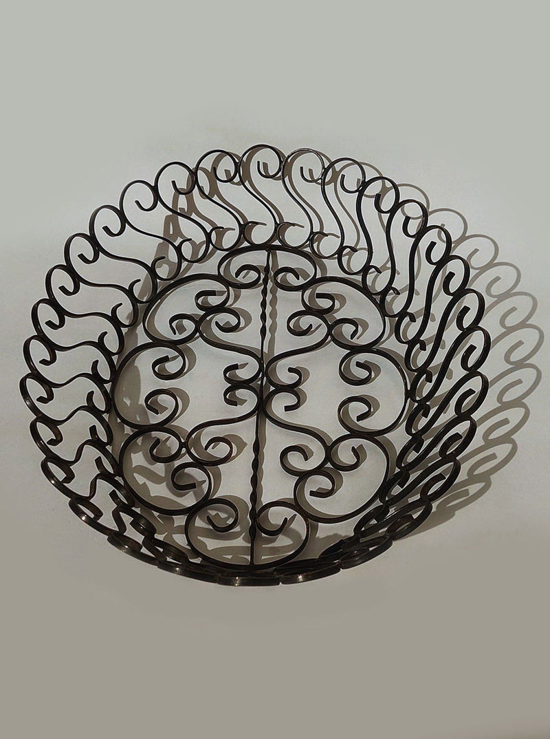 Vintage wrought iron decorative basket with scrollwork pattern 1950s