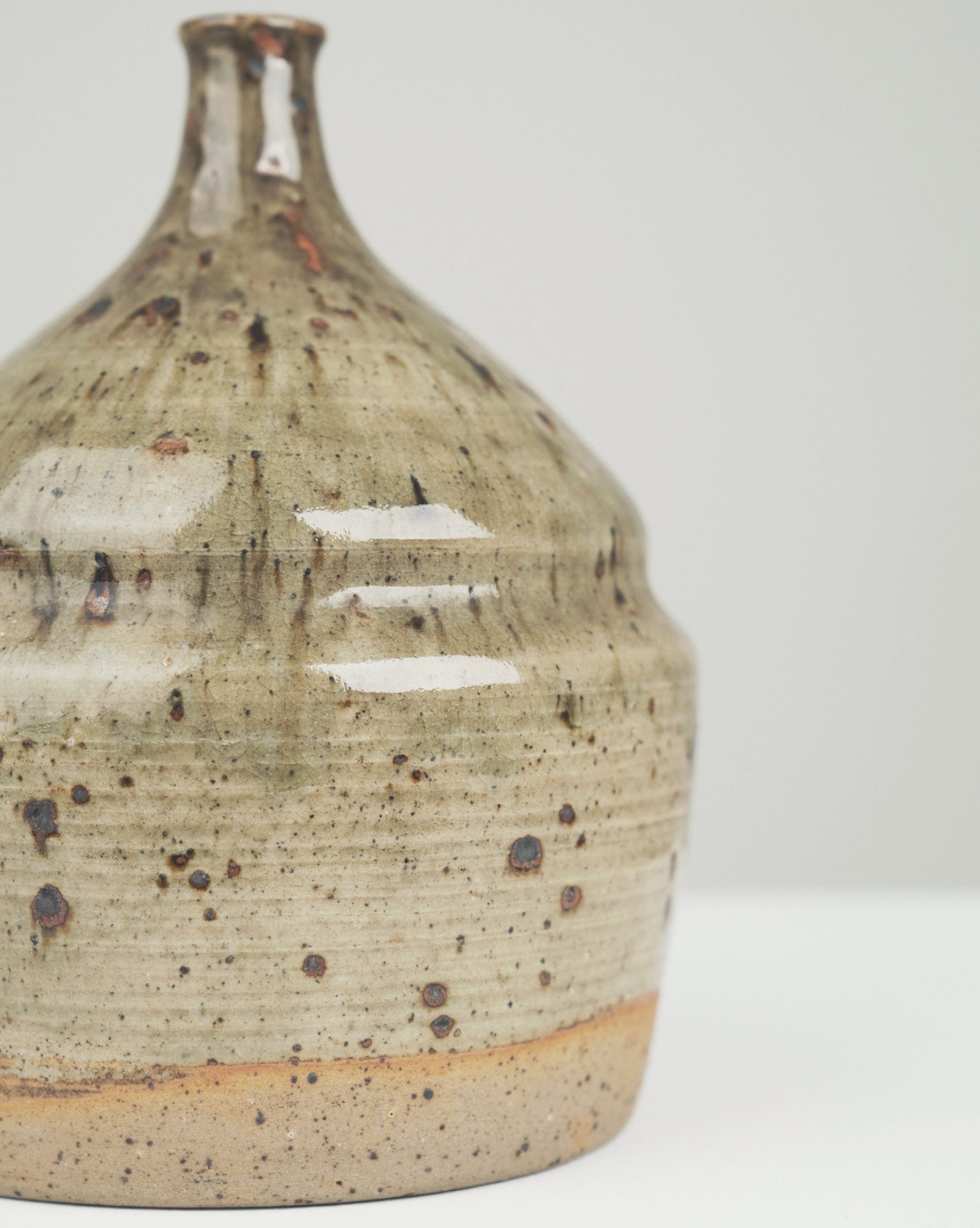 Ceramic soliflore vase detail showing speckled glaze texture