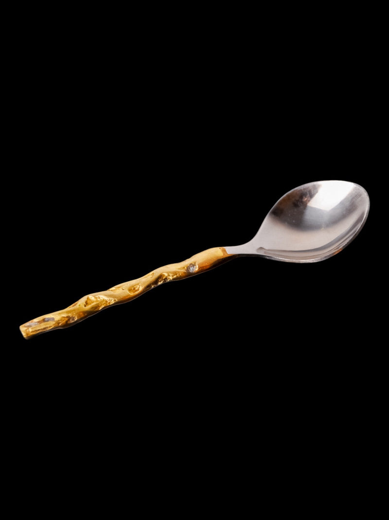 Brutalist teaspoon with wooden textured handle, design detail view