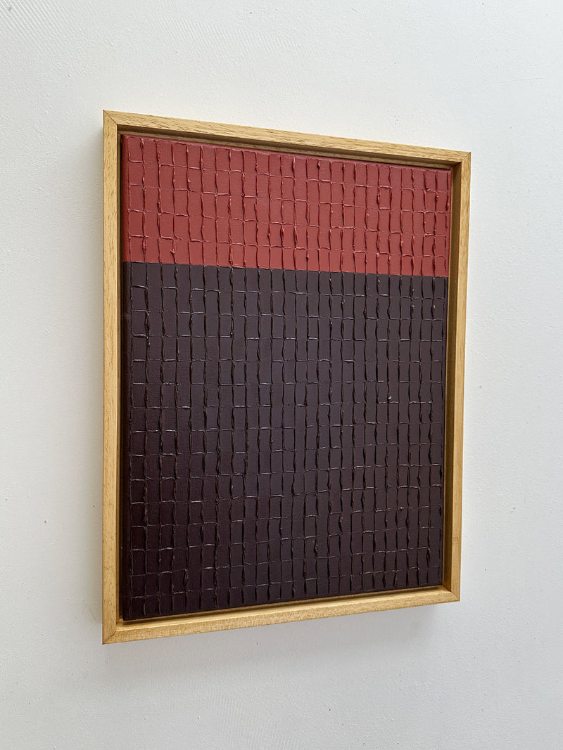 Textured red and brown abstract painting with geometric grid pattern