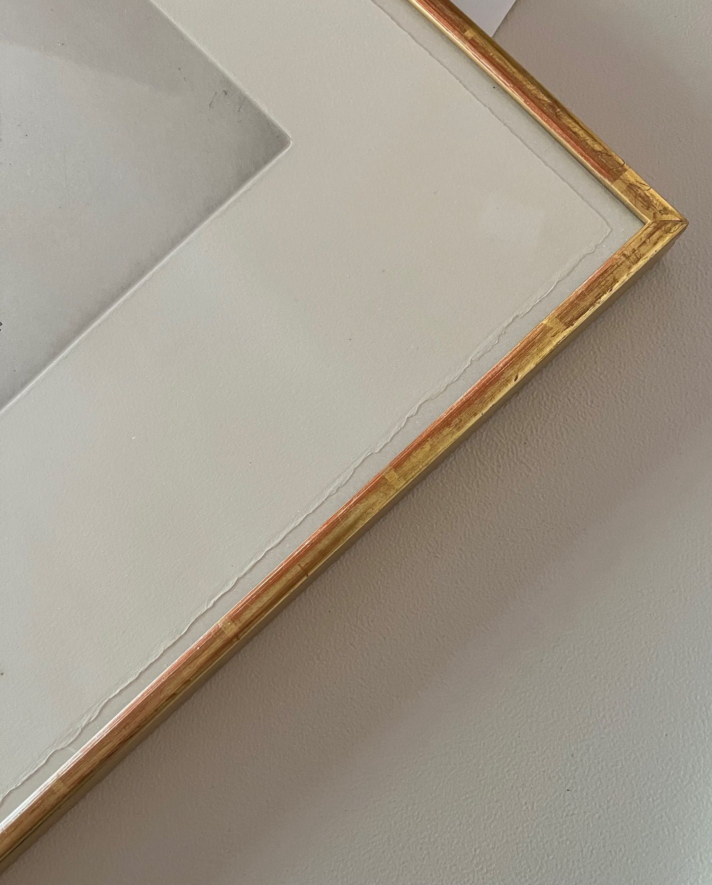 Corner detail of gold-leafed frame mounting for Fautrier drawing