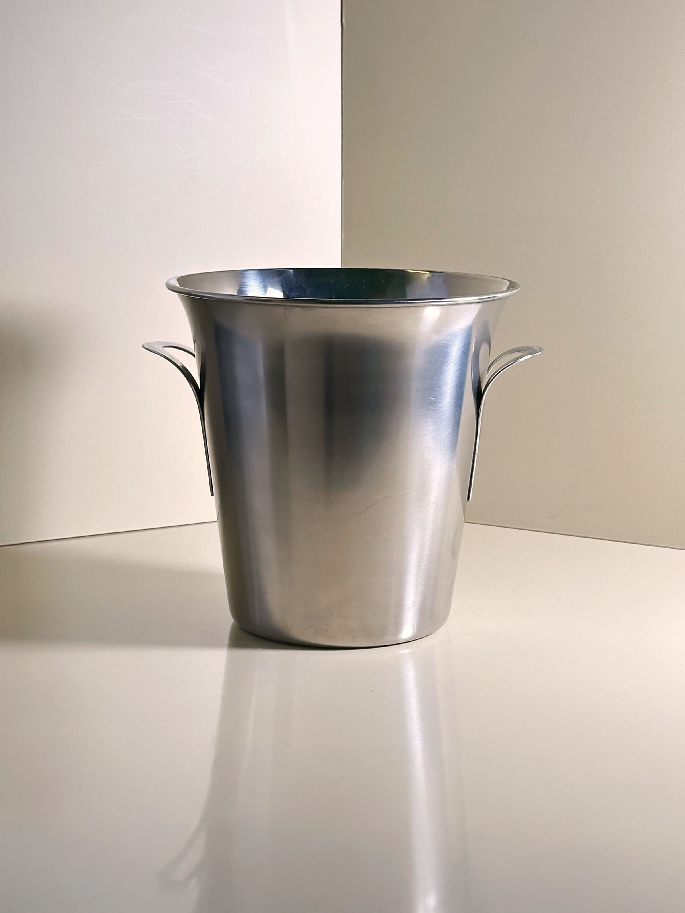 Stainless steel champagne ice bucket corner view with handles