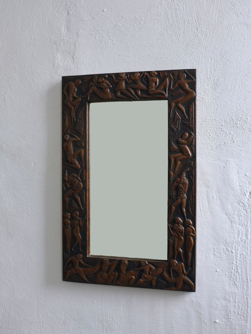 Copper relief carved mirror with figural scenes, Italian 1970s