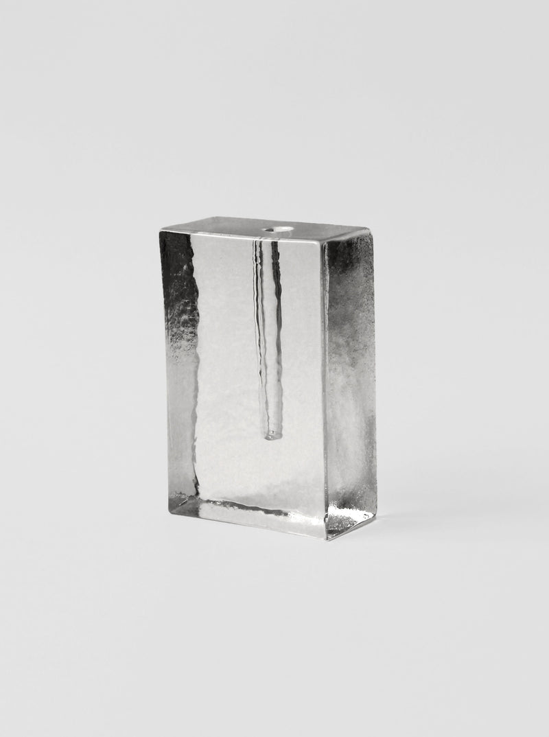 Clear glass block vase with rectangular form and internal cavity