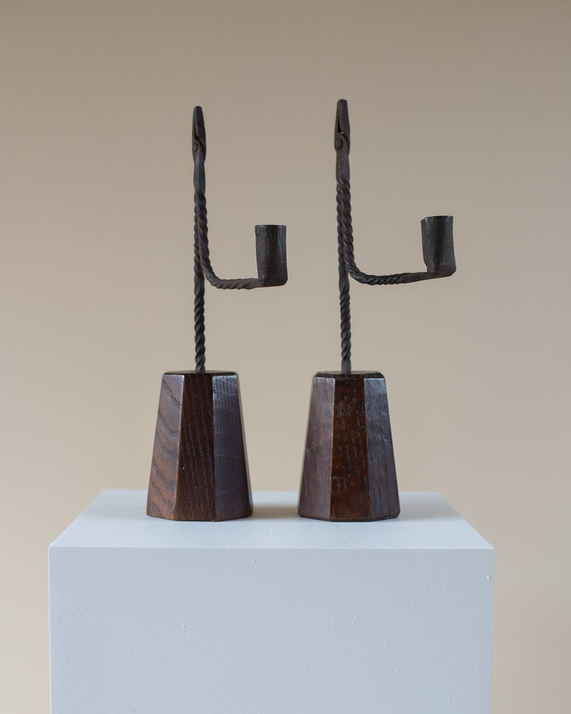 Pair of antique iron rushlight holders with wooden bases