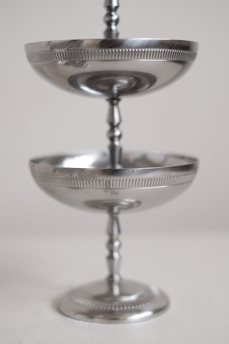 Stacked silver ice coupes showing elegant tiered design detail