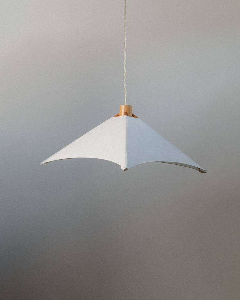 White pendant lamp with curved shade and wooden ceiling mount detail