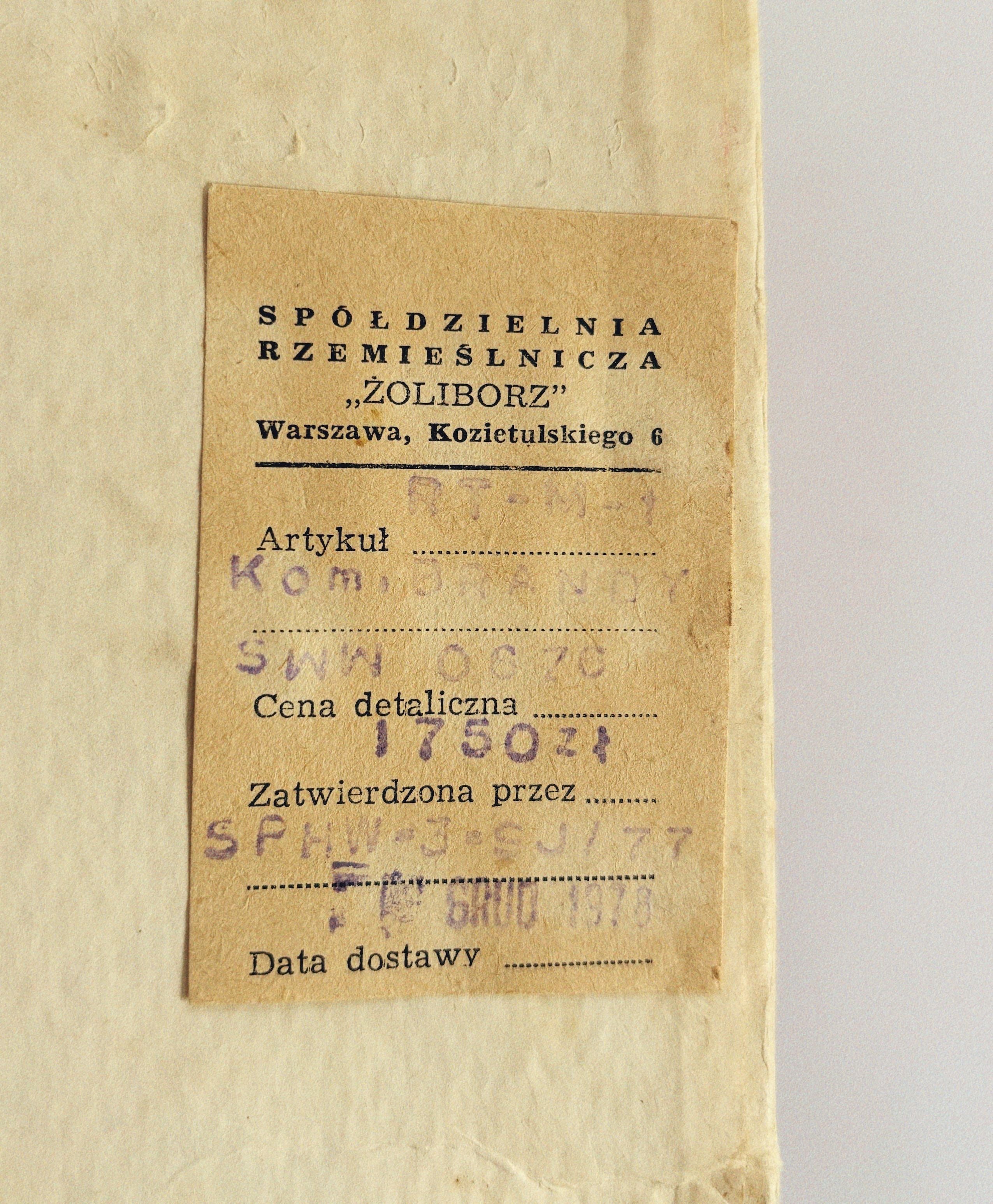 A vintage tag from the brand "Huerto" based in Warsaw is evocative of Poland's communist era, featuring areas for "Article," "Retail Price," "Approved by," and "Delivery Date." Against a background of aged paper, it indicates a price of 18.50 zł, possibly used for rare sets like the Silver Plated 70's Liquor Server.