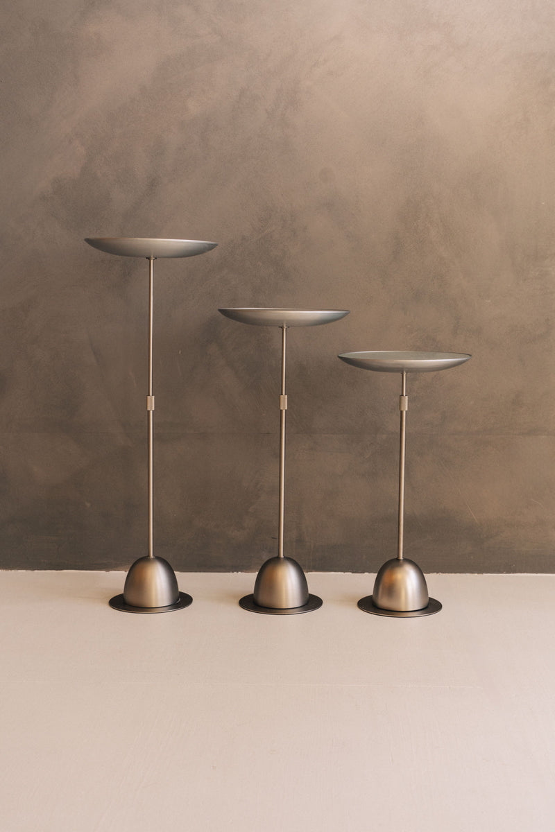 Three bronze adjustable side tables with dome bases by David Quan