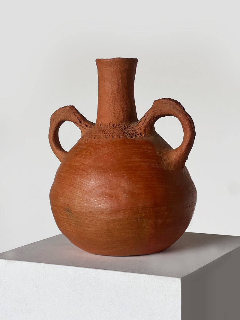 Terracotta handmade vessel with dual handles and cylindrical neck