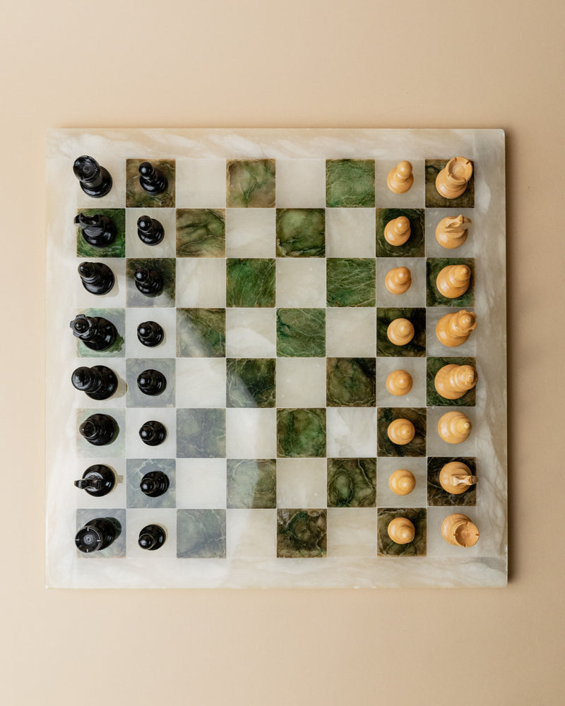 Italian marble chessboard with green veining and wooden pieces