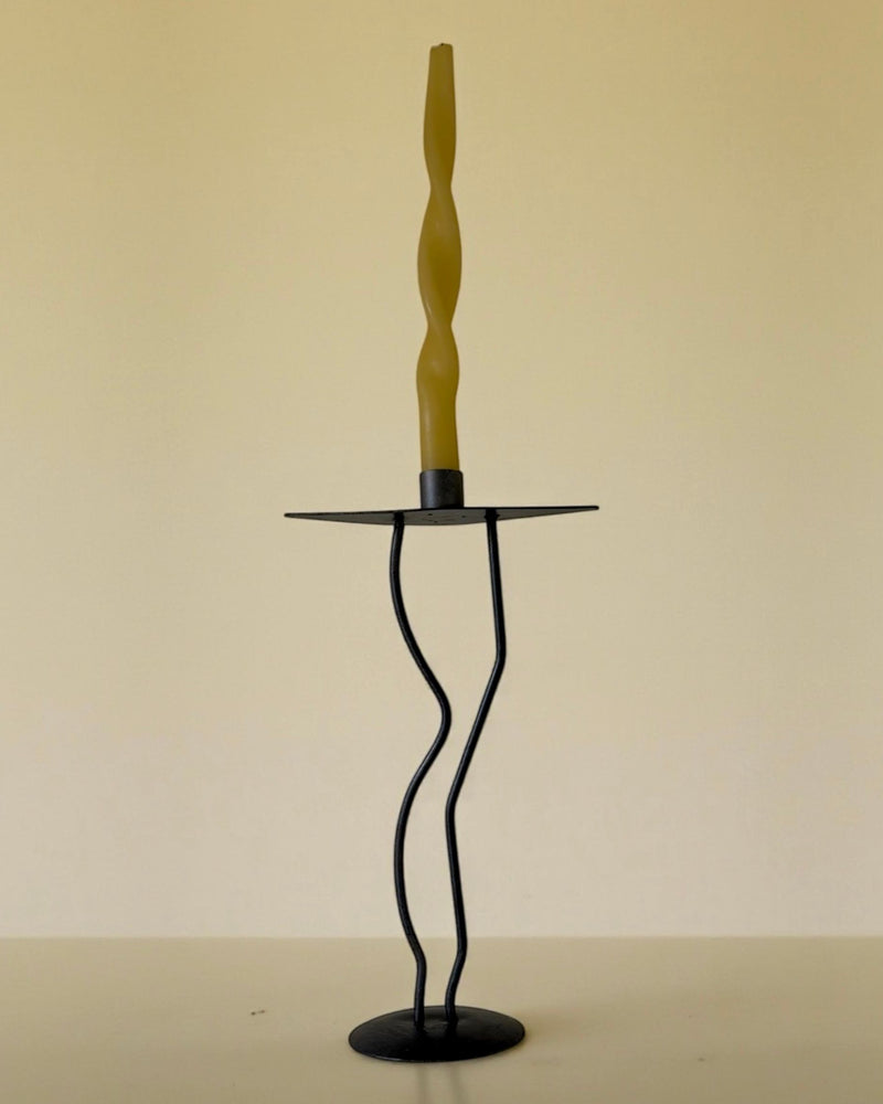 Curvy iron candle holder with twisted base and wooden handle