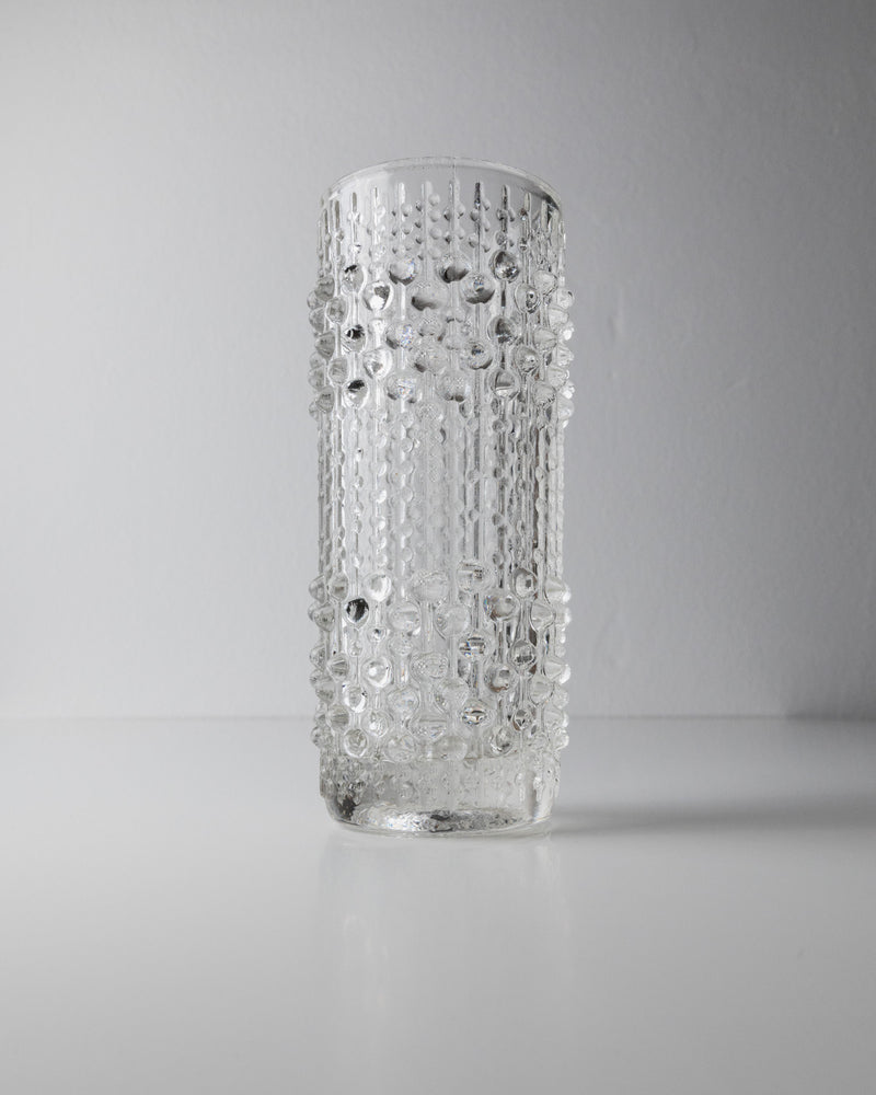 The Glass Vase by Frantisek Peceny (1965) for Bottega Jacobs features a raised droplet texture and stands on a smooth white surface against a plain light gray background.