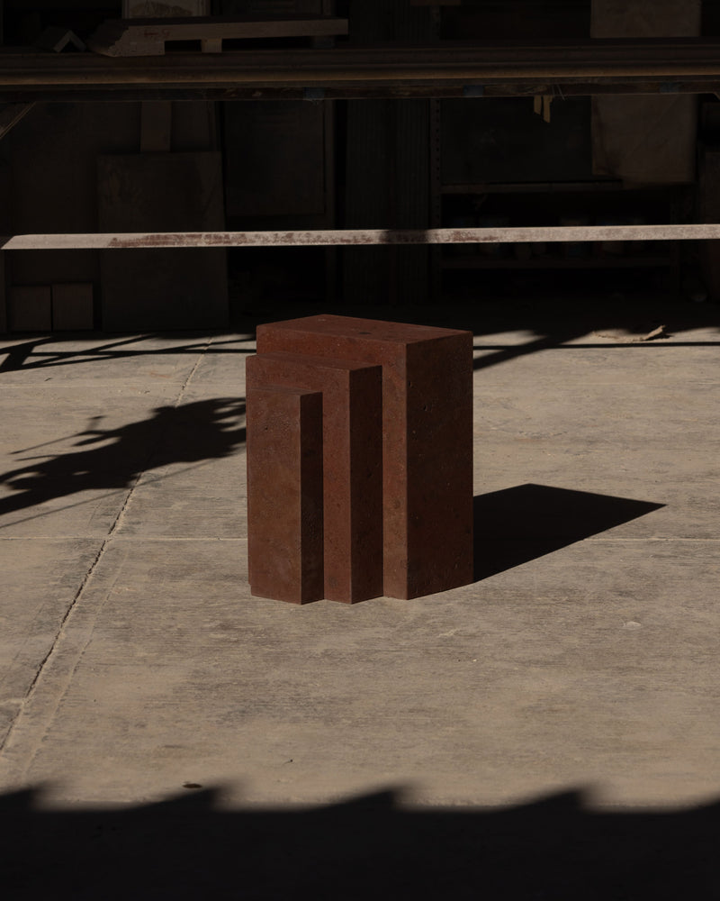 Coa tezontle stone side table with geometric cutout design