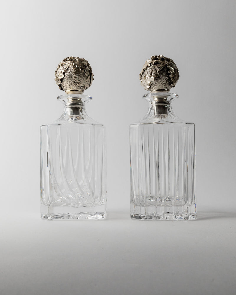 Two vintage crystal decanters with ornate silver stoppers, Italy 1950s