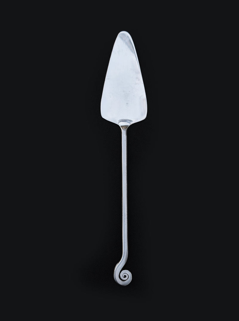Elegant silver spiral cake server with curved triangular blade