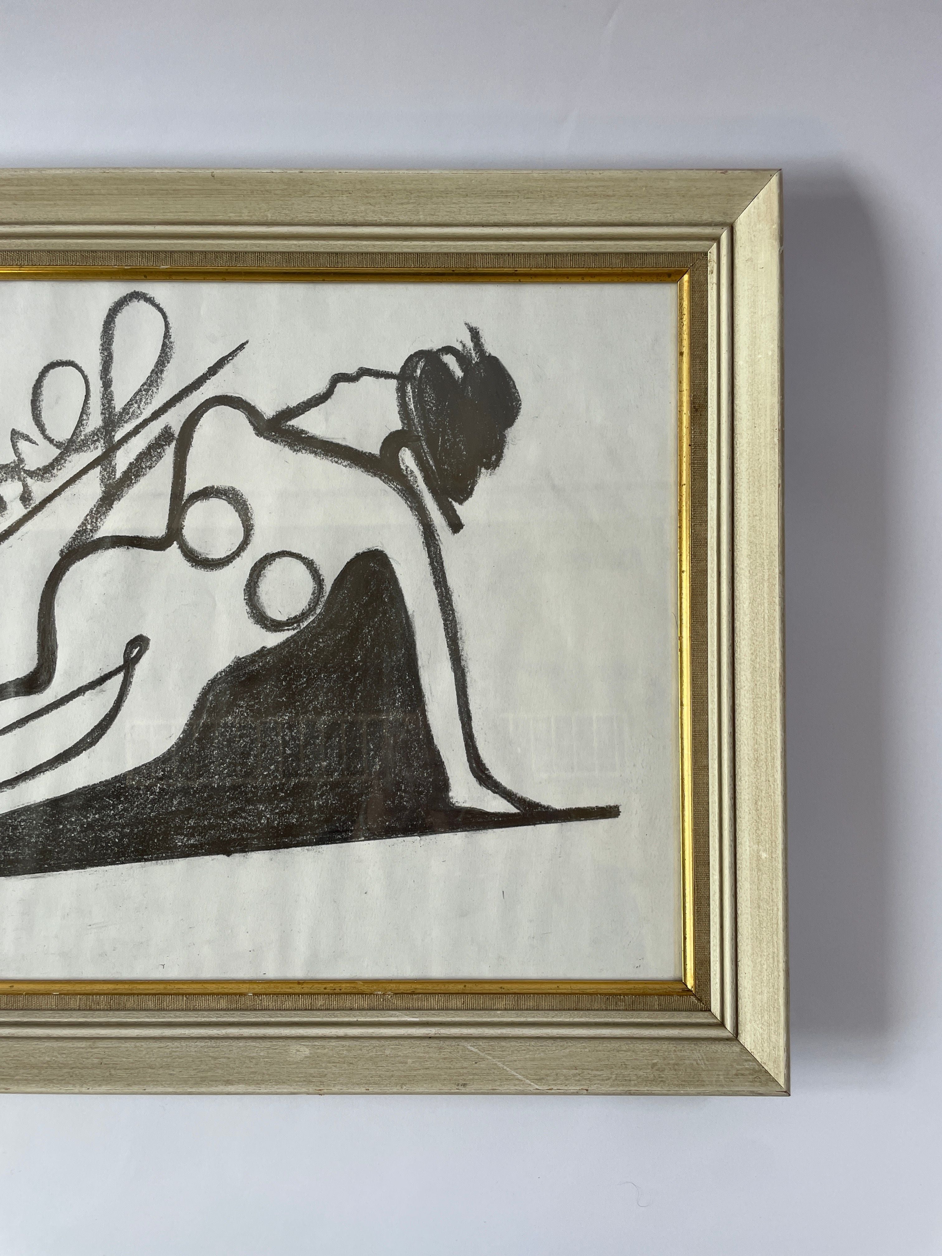 Brought to life by LA artist Akop Tashchyan, the 'Nude Artwork' from Maud Vaughan features a modern abstract design. It elegantly occupies a gold-framed canvas, showcasing a minimalist figure created with black lines and shapes against a pristine white background. This mixed media piece thoughtfully captures the essence of recline using strategic circular elements.