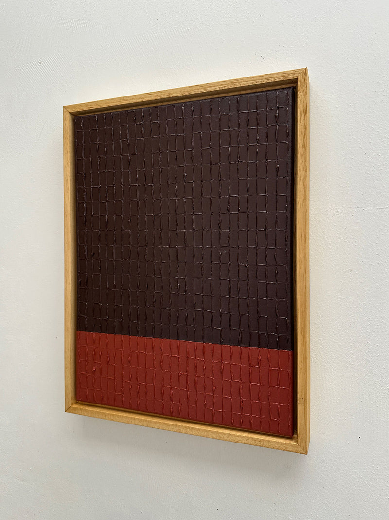 Textured red and brown abstract painting in natural wood frame